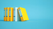 yellow and gray ring binders on a blue background