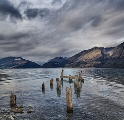 Canvas Print - Mountain lake with old ruined pier