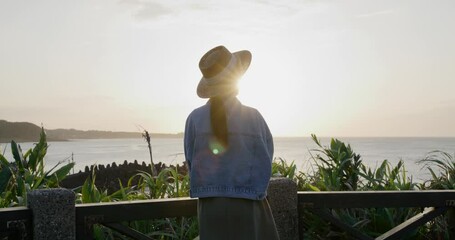 Poster - Woman look at the sunset sea view