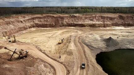 Wall Mural - Mining truck transports limestone from opecast, drone view. View of an open pit for extraction of dolomite and limestone. Anthropogenic landscape in open-pit mining. Haul truck in quarry. 