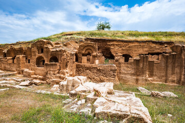 Wall Mural - Dara ancient site and the rock tombs near the city of Mardin, Turkey. The view of archaeological site of Dara, Mesopotamia, Turkey