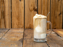 Old Fashioned Frothy Root Beer Ice Cream Float On A Rustic Wooden Background With Copy Space.