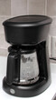 Black coffee maker to prepare American coffee with glass jug with reusable filter to put ground coffee and obtain the infusion preparing breakfast in the kitchen
