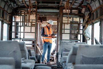 Canvas Print - Engineer under inspection and checking construction process railway switch and checking work on railroad station .Engineer wearing safety uniform and safety helmet in work.	