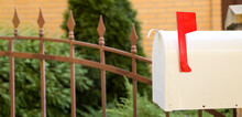 Vintage Mailbox With Red Flag Outdoors