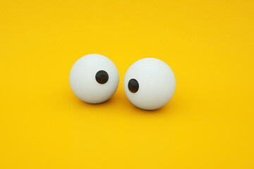 cartoon eyes over yellow background, 3d render