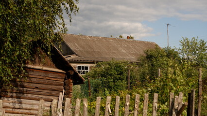 Wall Mural - Beautiful rustic summer landscape. Old wooden log houses. Vologda region