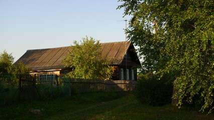 Wall Mural - Beautiful rustic summer landscape. Old wooden log houses. Vologda region