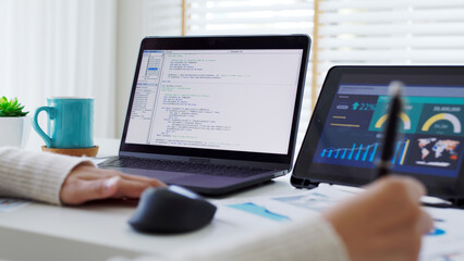 Back rear view of young asian woman, freelance data scientist work remotely at home coding programing on Big data mining, AI data engineering, IT Technician Works on Artificial Intelligence Project.