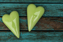 Green Hearts On Old Blue Wooden Background