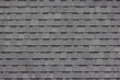 dark grey asphalt tiles decoration on house wall or roof. 