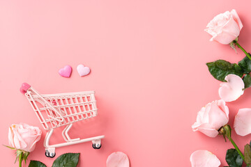 Mother's Day shopping design concept background with pink rose flower and cart on pink background.