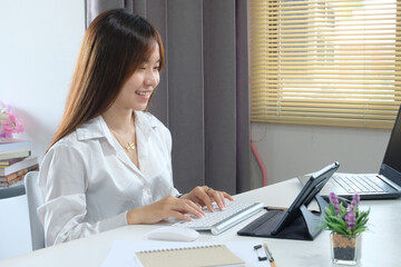 Sticker - Businesswoman typing on a laptop at work