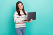 © deagreez - Photo of freelancer programmer cute positive lady hold netbook typing wear striped sweater isolated blue color background