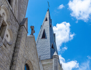 Church steeple against blue skies