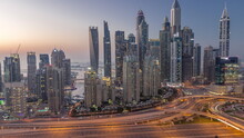 Skyscrapers Of Dubai Marina Near Intersection On Sheikh Zayed Road With Highest Residential Buildings Day To Night Timelapse