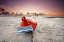 Red Buoy On The Beach