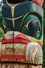 Isolated Face On A Pacific Northwest Indian Totem Pole.