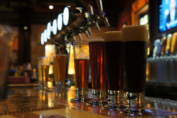 Sticker - Closeup shot of beer samples in tasting glasses at a brewery