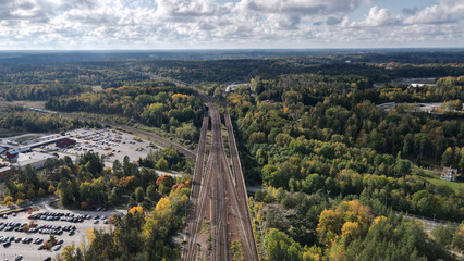 Canvas Print - Aerial shot of a highway road in the woods