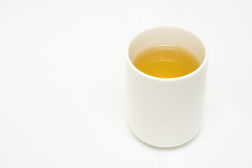 Green tea on a white background. Image of Japanese green tea. Cup of tea isolated on white background