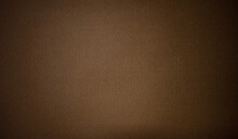Photo Of The Texture Of A Brown Background Made Of Soft Felt Fabric.Rag Brown Background With Black Vignette.