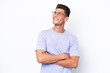 © luismolinero - Young caucasian man isolated on white background looking up while smiling