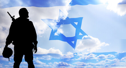 Silhouette of Soldier in sky background . Flag of Israel. National holiday .