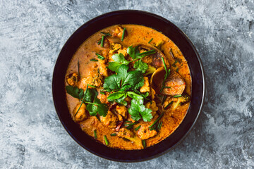 Wall Mural - vegan broccoli tofu and onion curry with fresh coriander and herbs as topping, healthy plant-based food recipes