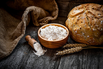 Wall Mural - Wheat flour on an old wooden table