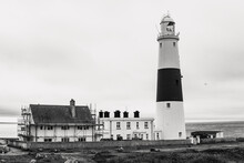 Grayscale Shot Of The Portland Bill Lighthouse On The Isle Of Portland, Dorset, England