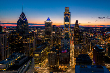 Wall Mural - Aerial Drone View of Philadelphia Skyline at Sunset with Glowing City Lights