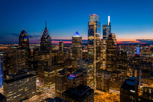 Aerial Drone View Of Philadelphia Skyline At Sunset With Glowing City Lights