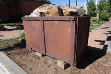 Old Rusty Mining Cart Upcycled As A Planter In Leadville, Colorado In USA On A Sunny Day
