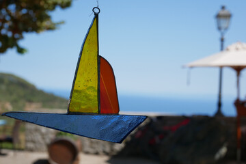 Sticker - Closeup shot of a colorful boat figure on a blurred background