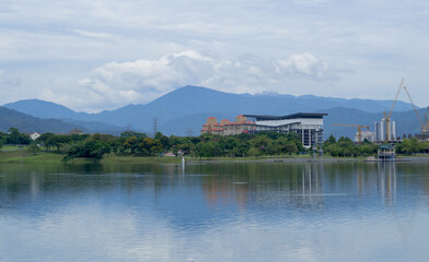 Green urban land on the coast of the lake in Kepong Metropolitan Park, Kuala Lumpur, Malaysia