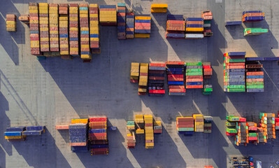 Aerial image of logistics platform with containers to import and export materials by ship