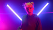 © stockbusters - Blonde artist dancing hip-hop at neon lights close up. Girl performing freestyle