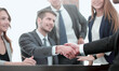 © ASDF - Handshake between employees after the meeting