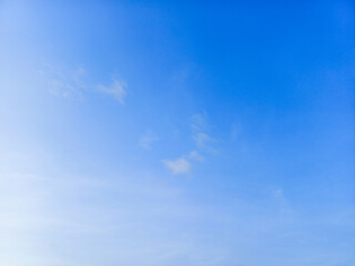 Blue sky with transparent clouds background