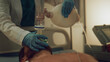 © stockbusters - Hand holding resuscitation bag in ward closeup. Hospital staff save patient life