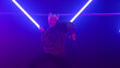 © stockbusters - Pretty girl dancing freestyle in club neon lights. Woman dancer moving body.
