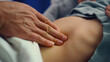 © stockbusters - Doctor hands touching stomach closeup. Sick little girl lying in hospital bed.