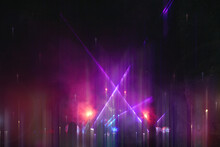 A Neon Abstract Concept. Of A Party At A Music Festival. With Lasers And Lights. With A Blurred Dream Like Edit