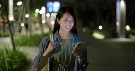 Canvas Print - Woman use mobile phone in city at night