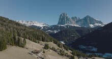 Aerial Landscape of Sassolungo Mountain and Val gardena Valley in spring. Aerial Dolomites