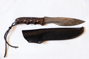 Combat knife homemade and a sheath on a white background close up, a soldier's knife