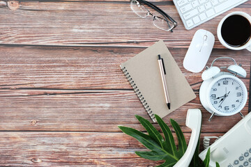 Poster - Office desk with keyboard computer, Pen, eyeglass, notebook, Cup of coffee on wood background, Top view with copy space, Mock up.