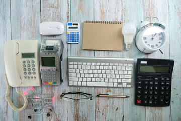 Poster - Office desk with computer keyboard, pen, eyeglasses, and notebook Top view with copy space of a cup of coffee on a black background Make a mockup.