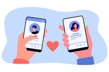Wall Mural - hands of male and female dating app users holding phones. people looking at profiles on social media